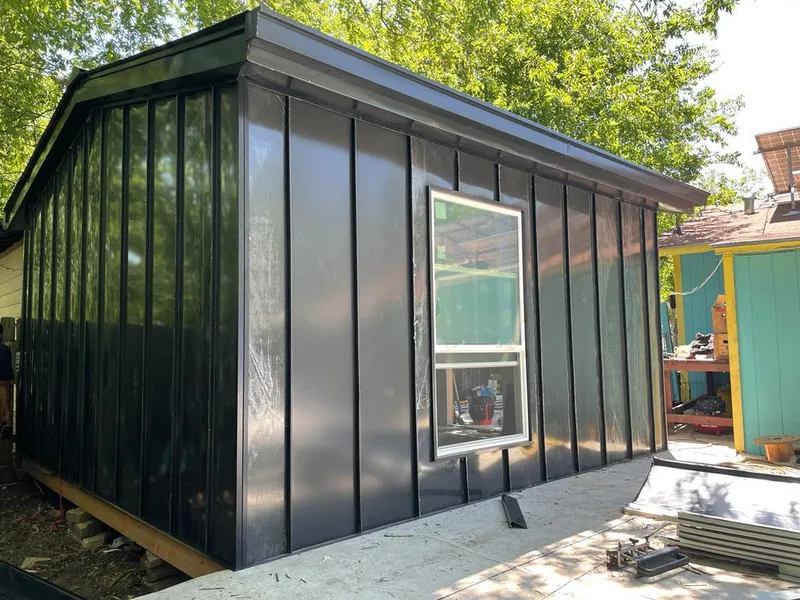 Black standing seam metal wall panels for Roof Inspection in Benton